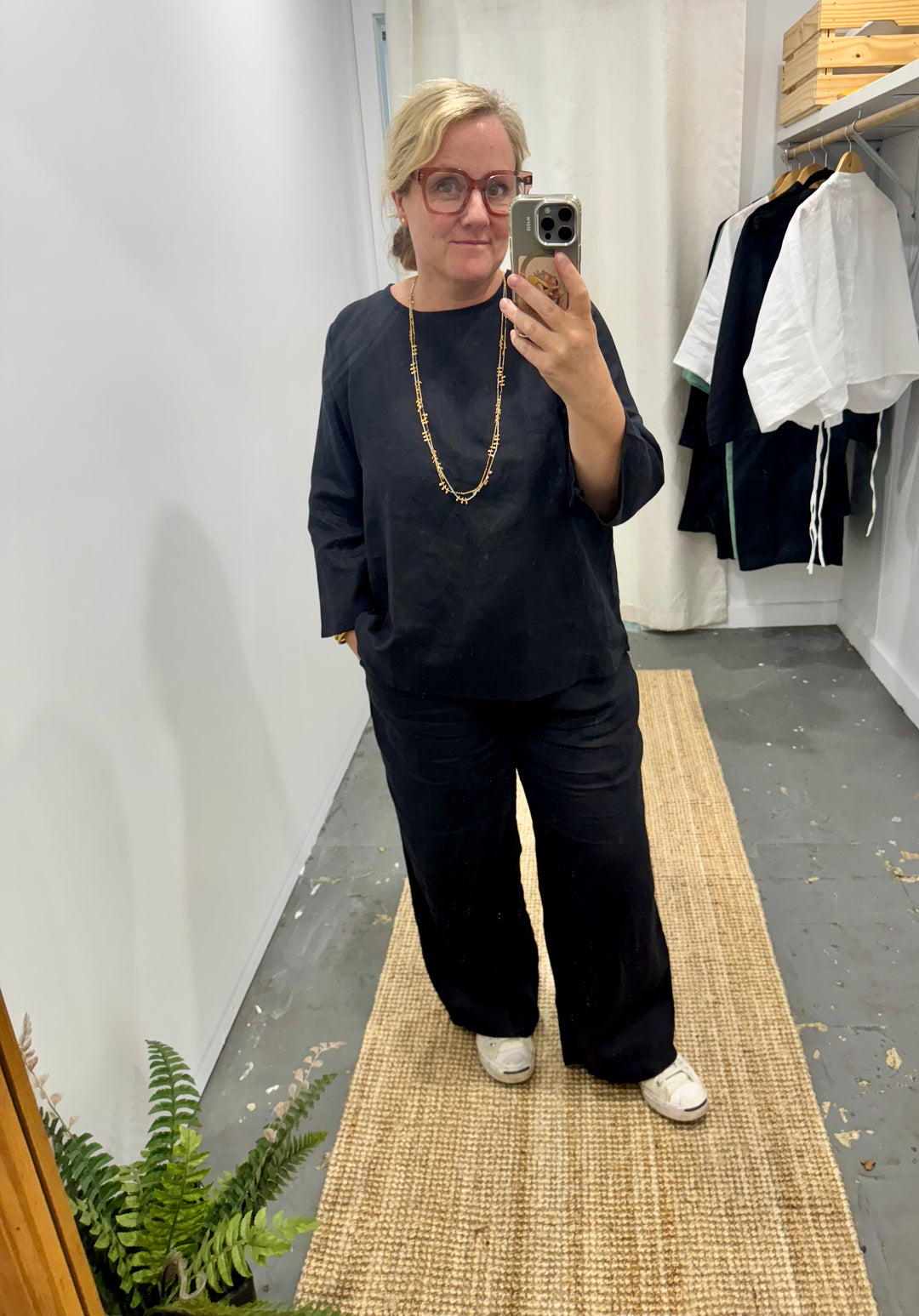 wide leg linen pant in black styled with long sleeve black top at jade and may