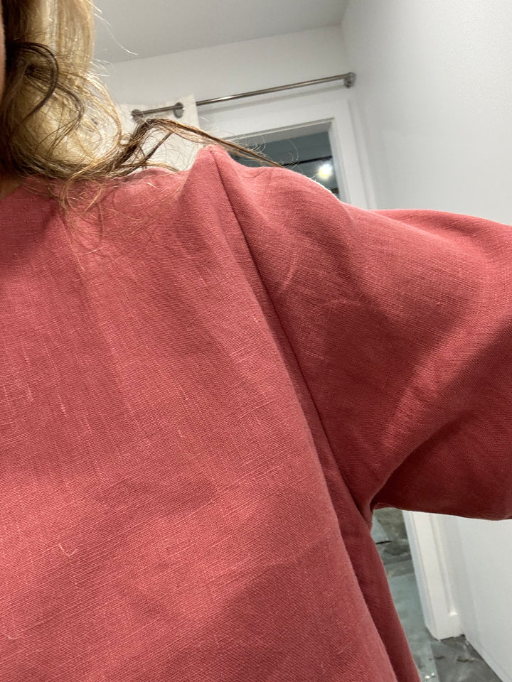 close up of long sleeve linen top at jade and may