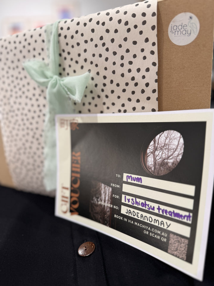 studio machiya shiatsu treatment gift voucher with a set of black bamboo pyjama set from jade and may