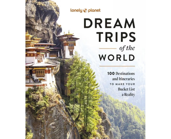 Book cover of 'Dream Trips of the World' by Lonely Planet with a temple on a cliff.