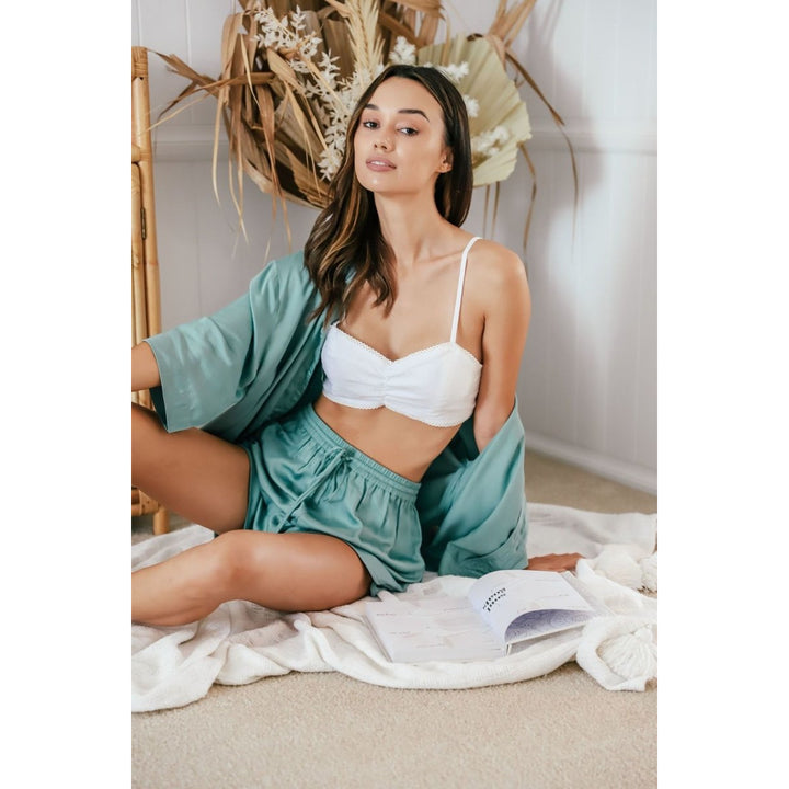 White linen bralette with adjustable straps and lace edging  worn by model – made from natural fibres by Jade and May