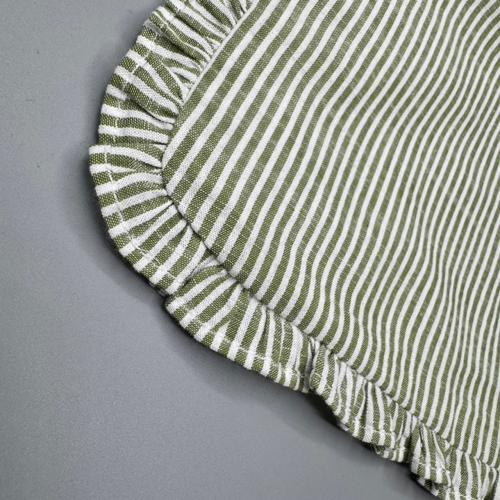 Close-up of a green and white striped fabric on a gray background