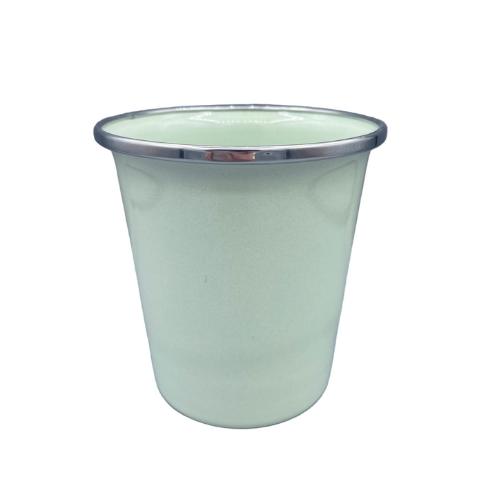 Light green cup with silver rim on a gray background