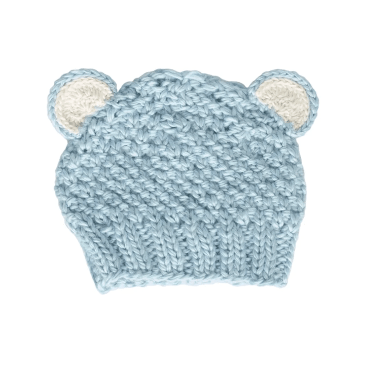Knitted baby hat with bear ears on a white background